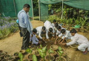 In gardening class, they learn to pot new plants…