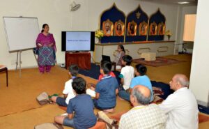 A volunteer makes Maths interesting in Vedic Mathematics class.