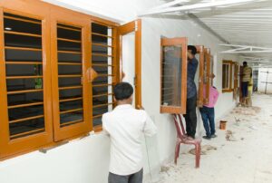 Windows being fitted and painted.