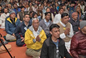 Devotees join in devotional chanting.