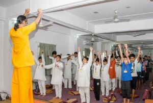 Brahmachari Alokananda leads the Energization Exercises.