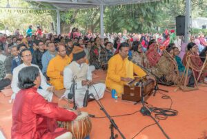 Chanting Guruji’s sacred name.