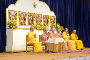 Swami Lalitananda leads the opening prayer.