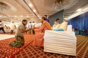 Swami Kamalananda distributes prasad.