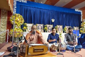 Swami Achyutananda leads chanting.