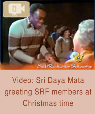 Daya Mata with SRF member at Christmas time.