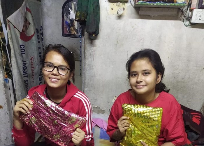 Girls show their gifts received from a YSS volunteer, Noida